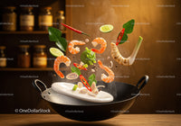 Fresh shrimp and herbs flying into wok pan with steam