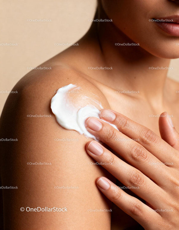 Woman applying moisturizer to smooth shoulder skin