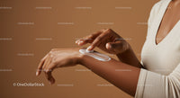 Close-up of Woman Applying Sunscreen Lotion on Arm for Skin Protection