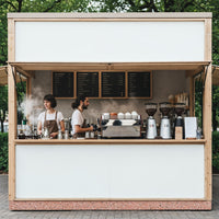 Baristas Preparing Coffee at Minimalist Outdoor Kiosk