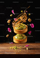 Elegant pistachio tarts with caramel decoration and petals