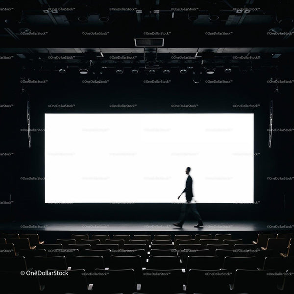 Silhouette of man walking on stage in empty theater JPG Mockup Image