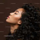 Profile of serene woman with voluminous curly hair