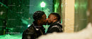 Affectionate Black Gay Couple Sharing a Kiss Outdoors