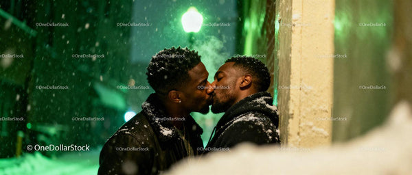 Affectionate Black Gay Couple Sharing a Kiss Outdoors