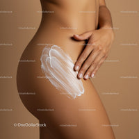 Close-up of Woman Applying Sunscreen on Thigh with Skin Care Focus