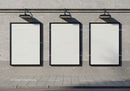 Three Blank Billboards Mounted on Concrete Wall