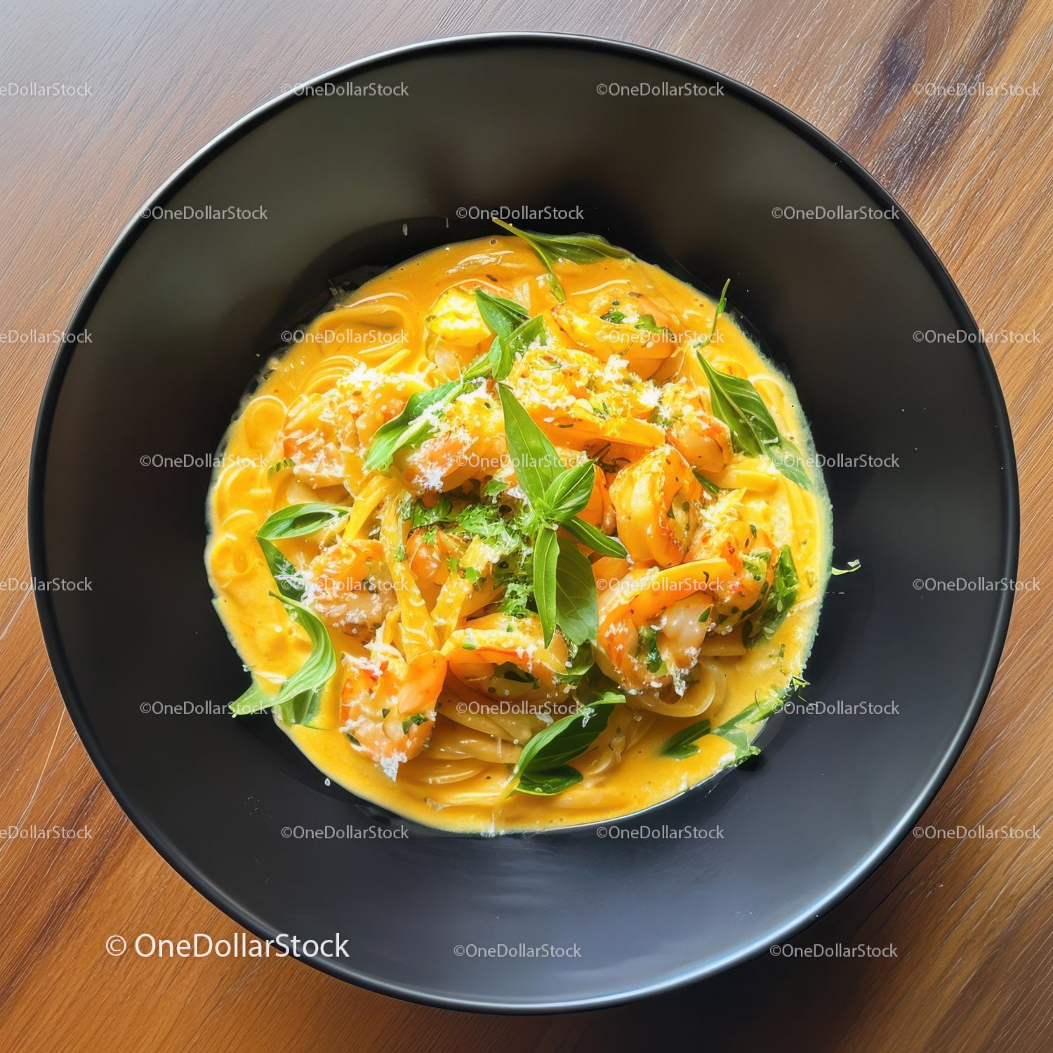 Creamy Pasta with Fresh Basil and Cheese Garnish in Black Bowl