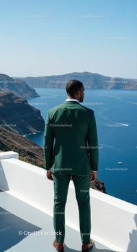 Man in Green Suit Overlooking Calm Blue Seascape