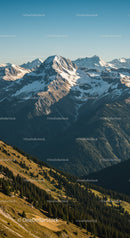 Majestic Snow-Capped Mountain Range with Green Forests and Scenic Views