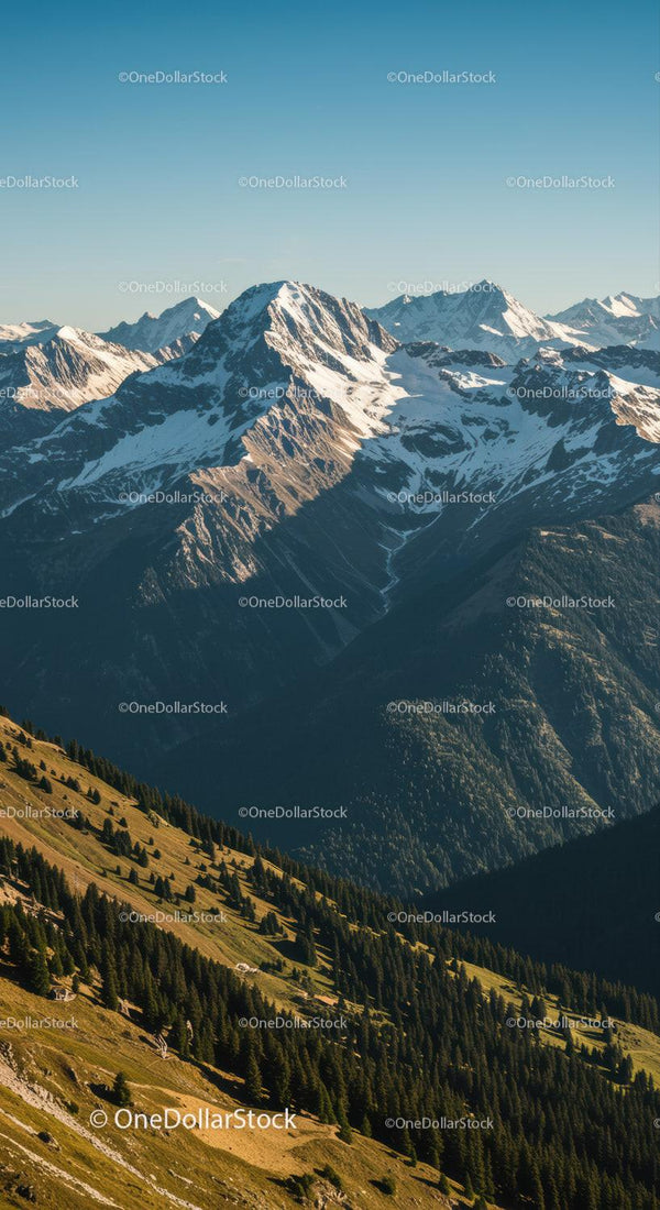 Majestic Snow-Capped Mountain Range with Green Forests and Scenic Views