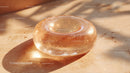 Luxurious Golden Glass Gemstone with Sparkling Glitter in Sunlight