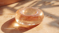 Luxurious Golden Glass Gemstone with Sparkling Glitter in Sunlight