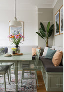 Cozy Modern Dining Room with Green Plants and Elegant Decor