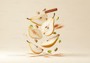 Sliced pears with cinnamon and pistachios floating in air