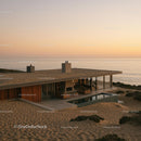 Modern Cliffside House with Glass Walls and Infinity Pool