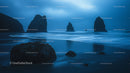 Misty Twilight Over a Serene Coastal Rock Formation