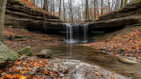 Tranquil Autumn Waterfall in a Serene Forest Setting