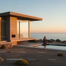 Luxury Glass House Overlooking Ocean at Sunset