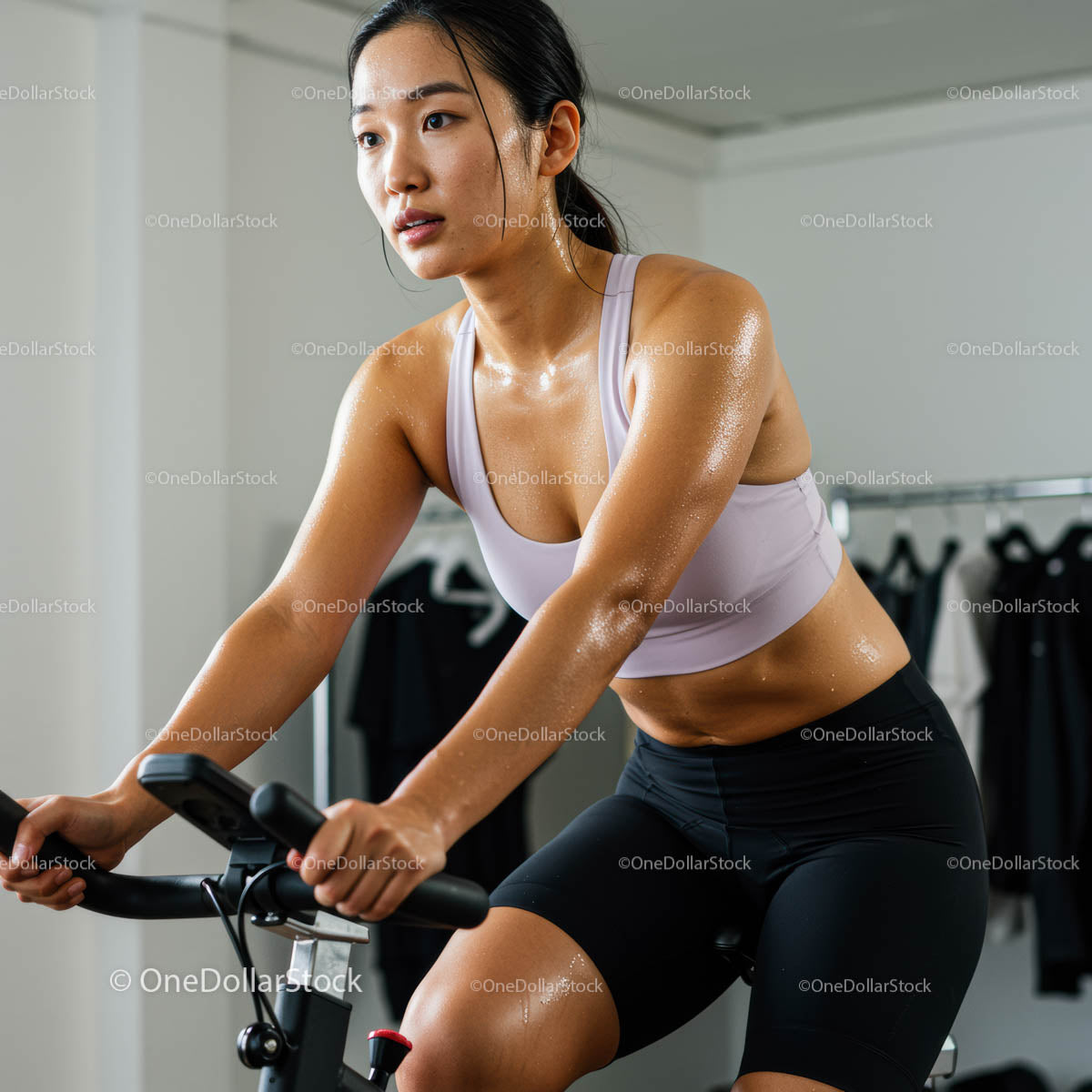 Woman Engaged in Intense Indoor Cycling Workout