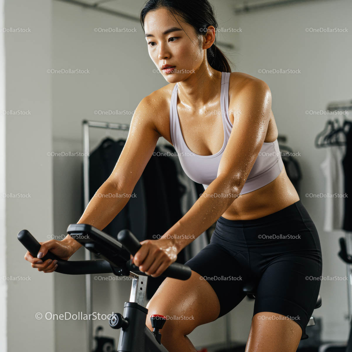 Focused Woman on Exercise Bike During Intense Workout
