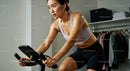 Focused Woman on an Indoor Cycling Workout