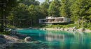 Modern Lakeside House Surrounded by Lush Green Forest