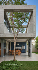 Modern Concrete Home with Open Patio and Tree