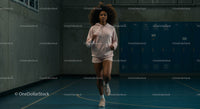 Athletic Woman Jogging Indoors in Casual Sportswear