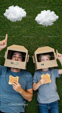 Father and Son Enjoy Creative Play with Cardboard Helmets
