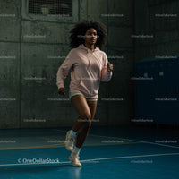 Determined Woman Running Indoors in a Gym