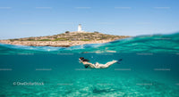 Snorkeler Explores Crystal Waters Near Lighthouse Island