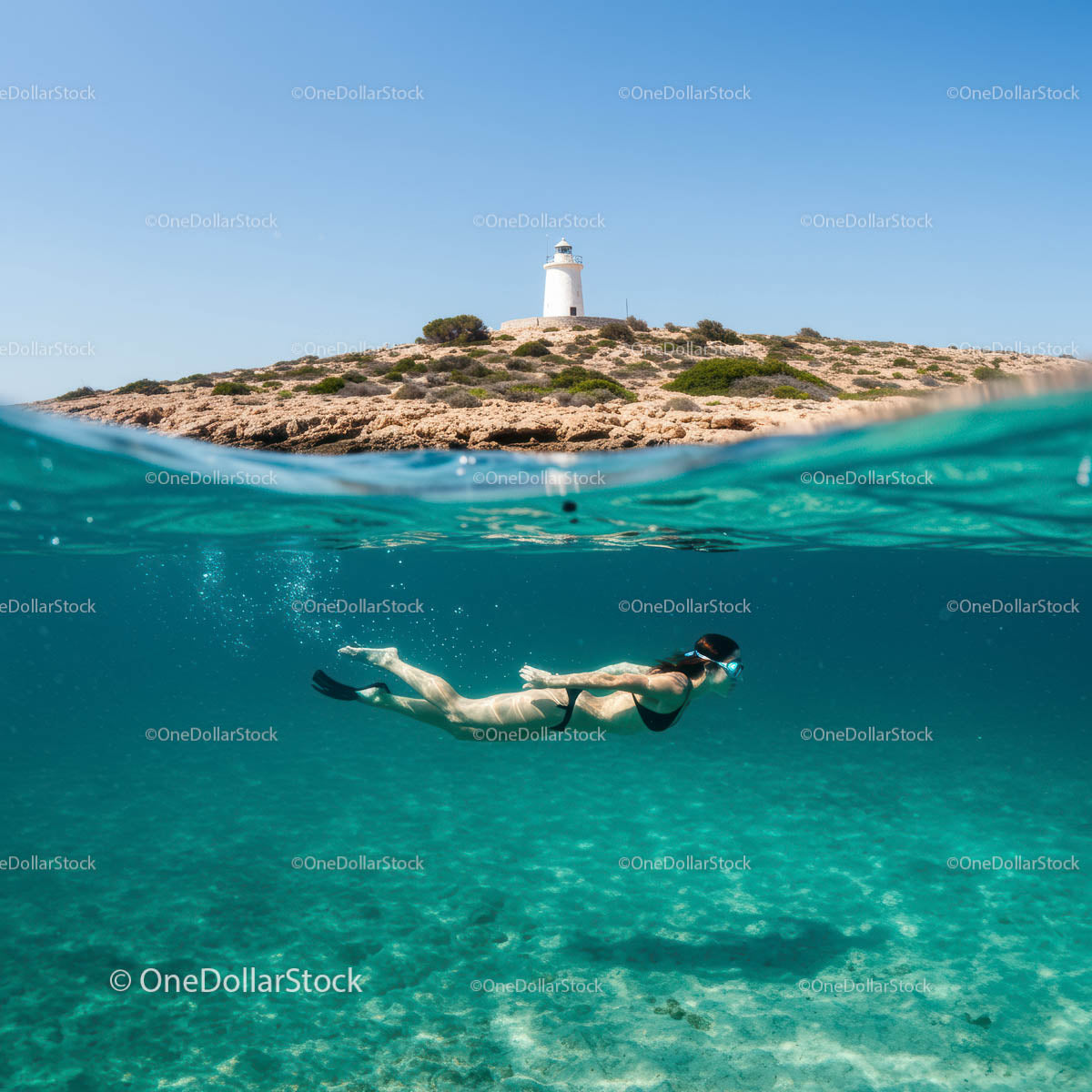 Snorkeler Beneath Turquoise Waves by Coastal Lighthouse