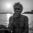 Senior Man Enjoying a Peaceful Sunset by the Ocean