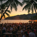 Tropical Beach Party at Sunset with Vibrant Crowd