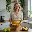 Smiling Woman Holding Homemade Apple Pie in Bright Kitchen