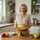 Woman Holding Homemade Apple Pie in Modern Kitchen