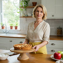 Woman in Cozy Kitchen with Homemade Apple Tart