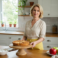 Woman in Cozy Kitchen with Homemade Apple Tart