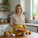 Woman with Apple Pie in a Bright Home Kitchen