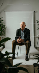 Senior Man in Business Casual Attire in Studio Setting