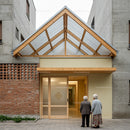 Elderly Couple at Modern Residential Entrance
