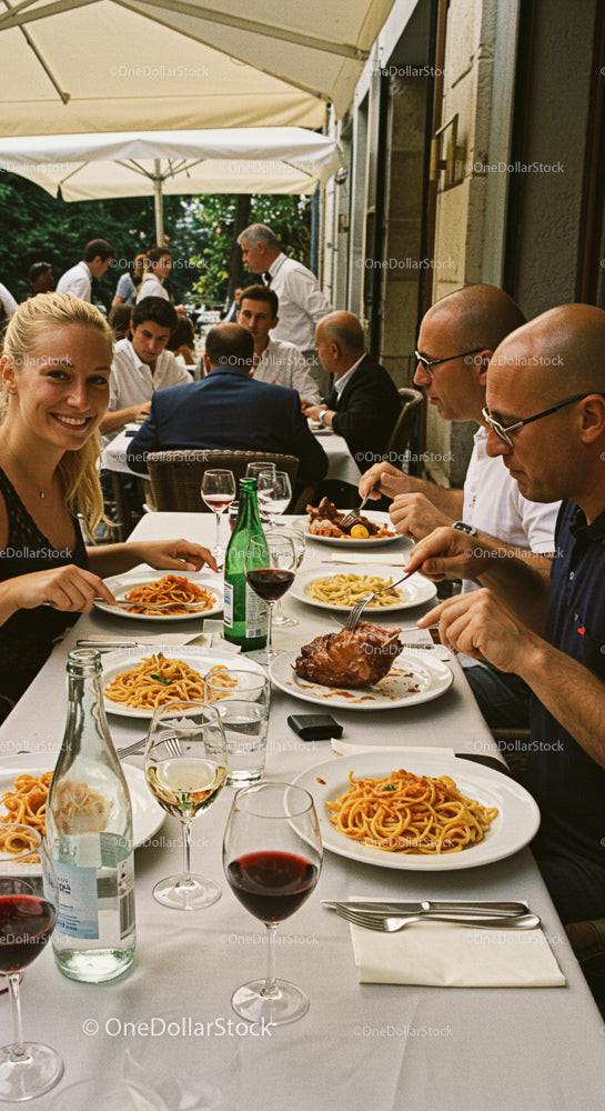 Group Enjoying Outdoor Italian Lunch with Wine