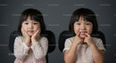Adorable Twin Girls with Playful Expressions