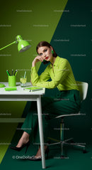 Elegant Woman in Green Outfit in a Modern Office Setting