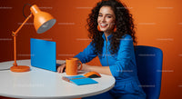 Smiling Woman in Vibrant Orange and Blue Workspace