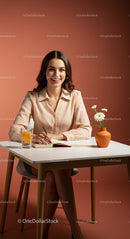 Smiling Woman in a Stylish Office with Daisies and Citrus Drink