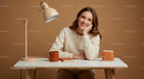 Smiling Woman in Warm-Toned Minimalist Workspace