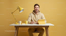 Smiling Man in Casual Style Working at Modern Yellow Workspace