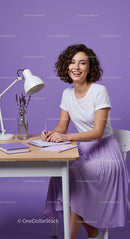 Smiling Woman Writing in Stylish Purple-Themed Workspace